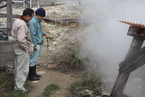 Scientists monitoring fumarole emissions, Unagi Village