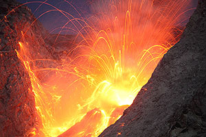 Nighttime explosive eruption producing dense hail of volcanic bombs, Batu Tara volcano, Indonesia
