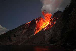 Ash cloud illuminated by lava, Batu Tara Volcano