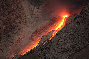 Close-up of extrusive activity producing continuous incandescent rockfalls, Batu Tara volcano, Komba Island, Indonesia