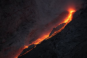 Close-up of extrusive activity producing continuous incandescent rockfalls, Batu Tara volcano, Indonesia