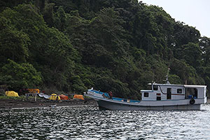 Camp on Komba island with tuna fishing boat