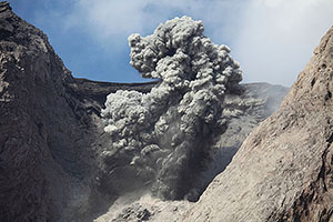 Explosive eruption producing dense ash cloud and volcanic bombs, Batu Tara volcano, Indonesia