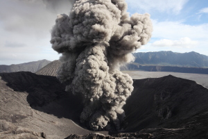 Eruption of ash cloud by Mount Bromo Volcano viewed from crater rim