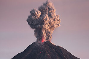 Eruption at dawn with visible incandescence, Colima volcano