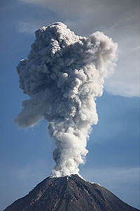 Sun illuminates ash cloud from Colima volcano, Mexico, following explosive eruption.