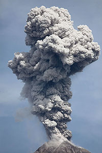 Ash cloud from vulcanian eruption of Colima volcano in sunlight, Mexico