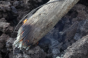 Burning foot of Electricity pole broken by lava flow, Fogo volcano