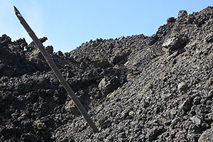 Electricity pole embedded in lava flow, Fogo volcano