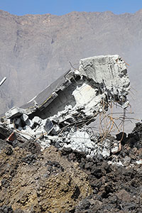 Mangled remains of concrete building in lava flow, portrait orientation, Fogo Caldera, 2014