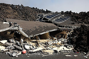 Building collapsed by passng lava flow, Fogo volcano, 2014