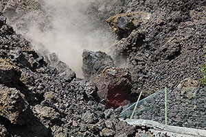 Glowing boulder rolls from top of lava flow deposit, Fogo volcano, 2014 eruption
