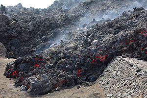 Lava flow crossing road near Portela, Fogo volcano, 2014 eruption