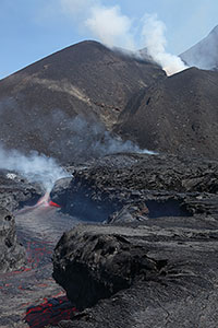 Lava flowing in channel at foot of eruptive complex, Fogo Volcano, 2014, Portrait orientation