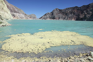 Kawah Ijen volcano,  Acidic crater lake, sulfur rafts on surface