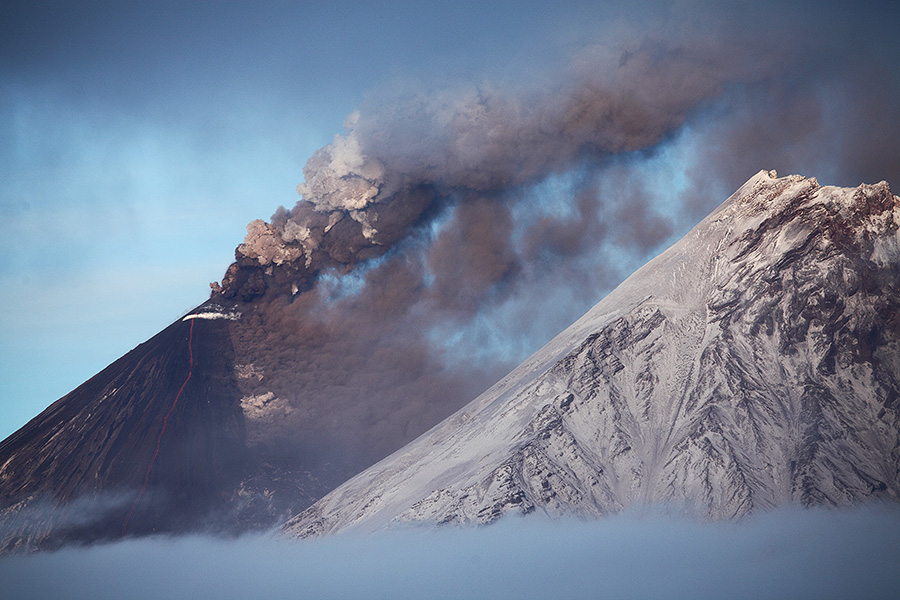 Kliuchevskoi volcano, also Klyuchevskoy or Klyuchevskaya Sopka, erupting ash and lava flow. Kamen volcano on right.