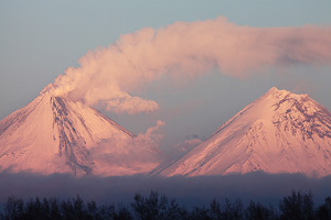 Plume from Kliuchevskoi volcano blowing over Kamen volcano