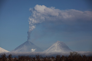 Kliuchevskoi volcano erupting ash cloud. Kamen volcano on right.