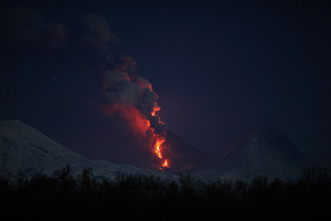 Kliuchevskoi volcano producing lava flow which is melting glacier