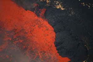 Lava spattering over rim of lava lake, Masaya volcano