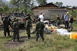 Military escort assembling at trailhead for Nyamuragira volcano trek