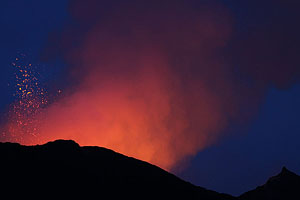 Nyamuragira Volcano vent erupting during blue hour