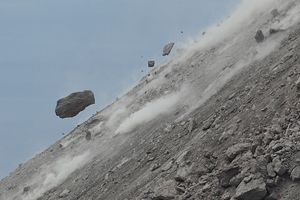 Rock bouncing down flank of lava dome