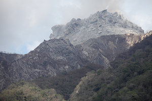 Degassing Rerombola lava dome viewed from boat, Paluweh volcano