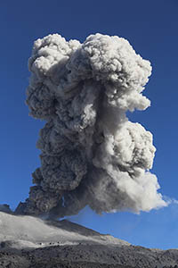 Ash cloud rises into blue sky, Sabancaya Volcano