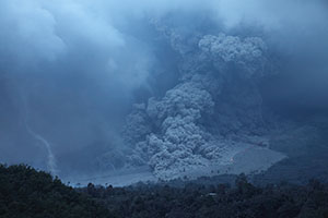 Pyroclastic Flows with tornado on flowfield at dusk, Sinabung Volcano