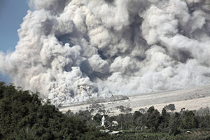 Pyroclastic Flow in sunlight passing church, Sinabung Volcano