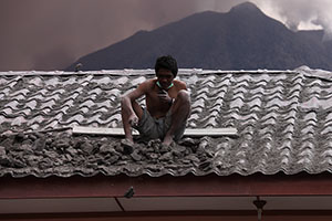 Cleaning ash off roof, Sinabung volcano