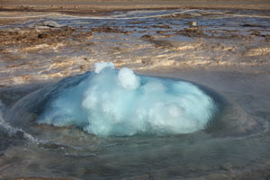 Strokkur Geysir. Geyser in Iceland, Bubble forming at beginning of eruption